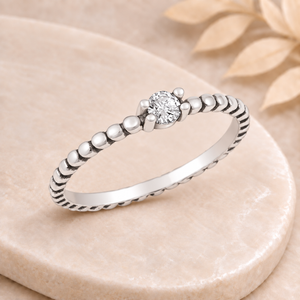 Bague Perline sur plateau beige marbré