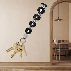 Porte-clé/bracelet fleurs noires